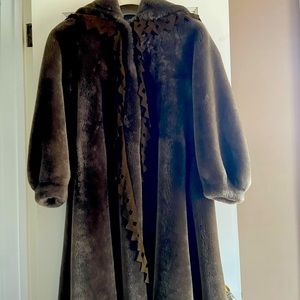 Lambskin full fur. Swing style with hood. Worn rarely.